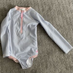 Rufflebutts brand girls swimsuit size 7. Excellent condition.